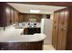 Functional kitchen with ample counter space, a white refrigerator, and plenty of wooden cabinetry for storage at 737 Howard St, Shelbyville, IN 46176