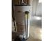 Whirlpool water heater sits in unfinished basement area at 737 Howard St, Shelbyville, IN 46176