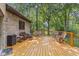 Outdoor deck with wicker furniture offers a cozy setting for relaxing in the backyard at 7612 Freedom Woods Dr, Indianapolis, IN 46259