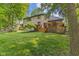 A sprawling backyard with a large wooden deck, perfect for outdoor gatherings and entertaining at 7612 Freedom Woods Dr, Indianapolis, IN 46259