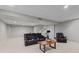 Finished basement offers comfortable seating area, neutral carpet, and recessed lighting at 7612 Freedom Woods Dr, Indianapolis, IN 46259
