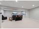 Finished basement with a comfortable seating area, kitchenette, recessed lighting, and neutral carpet at 7612 Freedom Woods Dr, Indianapolis, IN 46259