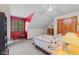 Cozy bedroom features bright red accent wall, window, and comfortable furniture at 7612 Freedom Woods Dr, Indianapolis, IN 46259