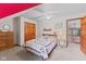 Cozy bedroom featuring a comfortable bed, ceiling fan, and access to a balcony at 7612 Freedom Woods Dr, Indianapolis, IN 46259