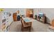 Attic bonus room featuring neutral carpet, angled ceiling, built in storage space, and small table at 7612 Freedom Woods Dr, Indianapolis, IN 46259