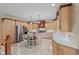 Gourmet kitchen featuring a center island, stainless steel refrigerator and light wood cabinetry at 7612 Freedom Woods Dr, Indianapolis, IN 46259