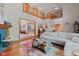 Spacious living room features hardwood floors, comfortable seating, and open floor plan at 7612 Freedom Woods Dr, Indianapolis, IN 46259