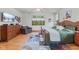 Cozy main bedroom with a plush bed, dresser, side tables, and ceiling fan at 7612 Freedom Woods Dr, Indianapolis, IN 46259