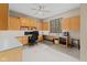Bright office space featuring custom built-in shelves, desk and a ceiling fan with great lighting at 7612 Freedom Woods Dr, Indianapolis, IN 46259