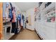 Large walk-in closet with custom shelving, hanging rods, and drawers for optimal organization at 7612 Freedom Woods Dr, Indianapolis, IN 46259