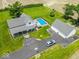 Aerial view of property featuring a large lot, pool, wrap around porch, and detached garage at 7728 W 200 S, New Palestine, IN 46163