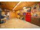 Spacious basement with wood-paneled walls, cabinets, and work benches at 7728 W 200 S, New Palestine, IN 46163