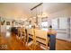 Open-concept kitchen with counter seating, pendant lights, and stainless steel appliances at 7728 W 200 S, New Palestine, IN 46163