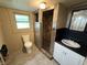 Bathroom features a walk-in shower, tiled walls, and updated sink at 807 N Elm St, Muncie, IN 47305