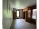 Bedroom with wood floors and trim, with good natural light at 807 N Elm St, Muncie, IN 47305