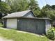 A detached garage with both sliding and swing out doors, offering ample storage space at 807 N Elm St, Muncie, IN 47305
