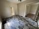 An empty living room with patterned flooring and archways, ready for customization at 807 N Elm St, Muncie, IN 47305