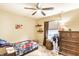 Charming bedroom with ceiling fan, neutral colors, and carpeted floors at 8116 Harshaw Dr, Indianapolis, IN 46239