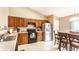 Bright eat-in kitchen features stainless steel appliances, wooden cabinets and a breakfast nook at 8116 Harshaw Dr, Indianapolis, IN 46239