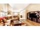 Large living room with hardwood floors and a vaulted ceiling, offering plenty of space for relaxation and entertainment at 8116 Harshaw Dr, Indianapolis, IN 46239