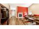 Spacious living room featuring hardwood floors and a fireplace creating a great space for entertaining at 8116 Harshaw Dr, Indianapolis, IN 46239