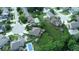 Aerial view of a home with a large yard, a swimming pool, mature trees, and a privacy fence at 8144 Grassy Meadow Cir, Indianapolis, IN 46259