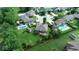 Aerial view of a home with a large yard, a swimming pool, mature trees and a privacy fence at 8144 Grassy Meadow Cir, Indianapolis, IN 46259
