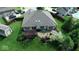 Back exterior view featuring a deck with outdoor seating, a hot tub, and a well-maintained lawn at 8144 Grassy Meadow Cir, Indianapolis, IN 46259