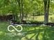 Well-manicured backyard with neatly mulched garden beds, adding an elegant touch to the outdoor space at 8144 Grassy Meadow Cir, Indianapolis, IN 46259