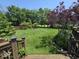 A beautiful backyard features a healthy lawn, lovely landscaping, and privacy trees at 8144 Grassy Meadow Cir, Indianapolis, IN 46259