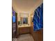 Classic bathroom has a wooden vanity, large mirror, and a neutral color palette at 8144 Grassy Meadow Cir, Indianapolis, IN 46259
