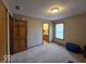 Neutral bedroom has carpet, a window, and access to a bathroom at 8144 Grassy Meadow Cir, Indianapolis, IN 46259