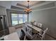 Bright dining area with chandelier lighting and a large window view at 8144 Grassy Meadow Cir, Indianapolis, IN 46259
