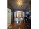 Open foyer with hardwood floors, archway, and view of the front door at 8144 Grassy Meadow Cir, Indianapolis, IN 46259