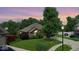Beautiful brick home with mature trees and a lush green lawn at 8144 Grassy Meadow Cir, Indianapolis, IN 46259