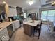 Bright kitchen featuring an island, stainless steel appliances, and modern cabinetry at 8144 Grassy Meadow Cir, Indianapolis, IN 46259