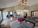 Cozy living room with hardwood floors, seamless flow to an office, and comfortable sectional sofa at 8144 Grassy Meadow Cir, Indianapolis, IN 46259