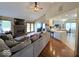 Open concept living room with fireplace, seamlessly connecting to the kitchen with breakfast bar seating at 8144 Grassy Meadow Cir, Indianapolis, IN 46259