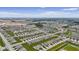 Aerial view showcases the planned community layout, featuring ponds, green spaces, and neatly arranged homes at 820 Elise Dr, Westfield, IN 46074