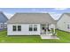 Manicured backyard with a covered patio and a well-maintained lawn at 820 Elise Dr, Westfield, IN 46074