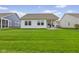 Grassy backyard featuring a patio with seating, ideal for relaxation and entertainment at 820 Elise Dr, Westfield, IN 46074