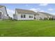 Spacious backyard with manicured lawn and patio, offering ample space for outdoor enjoyment at 820 Elise Dr, Westfield, IN 46074