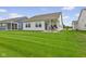Expansive backyard with lush green grass, patio, and plenty of room for outdoor activities at 820 Elise Dr, Westfield, IN 46074
