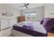 Bright bedroom with a large window, neutral walls, and stylish furnishings at 820 Elise Dr, Westfield, IN 46074