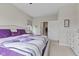 Comfortable bedroom featuring a plush bed with purple accents and ample closet space at 820 Elise Dr, Westfield, IN 46074