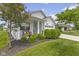 A well-manicured yard with bench seating near the front porch and a single-story home in the background at 820 Elise Dr, Westfield, IN 46074
