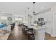Open concept kitchen with white cabinets and a large island with seating at 820 Elise Dr, Westfield, IN 46074