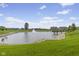Picturesque pond view with a fountain, small bridge, and well-maintained grassy areas at 820 Elise Dr, Westfield, IN 46074