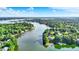 Scenic aerial view of waterfront homes nestled along the lake's shoreline and tree-lined community at 8261 Twin Pointe Cir, Indianapolis, IN 46236