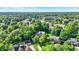 Lush, leafy neighborhood, with green trees shading lovely residences, community lake, and a beautiful blue sky at 8261 Twin Pointe Cir, Indianapolis, IN 46236